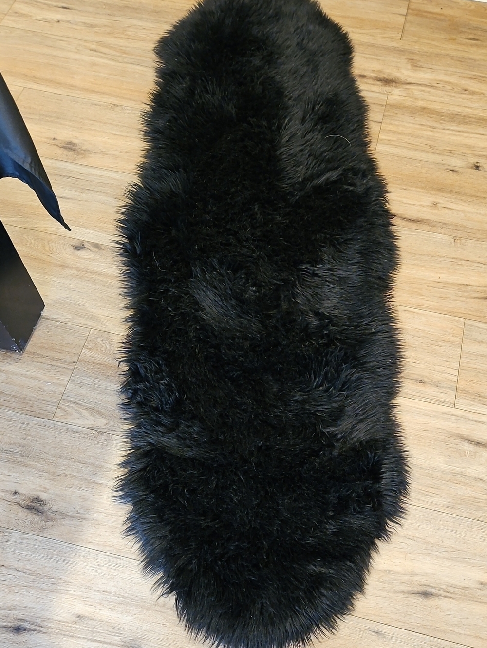 Ashler Black Faux Sheepskin Accent Rug.